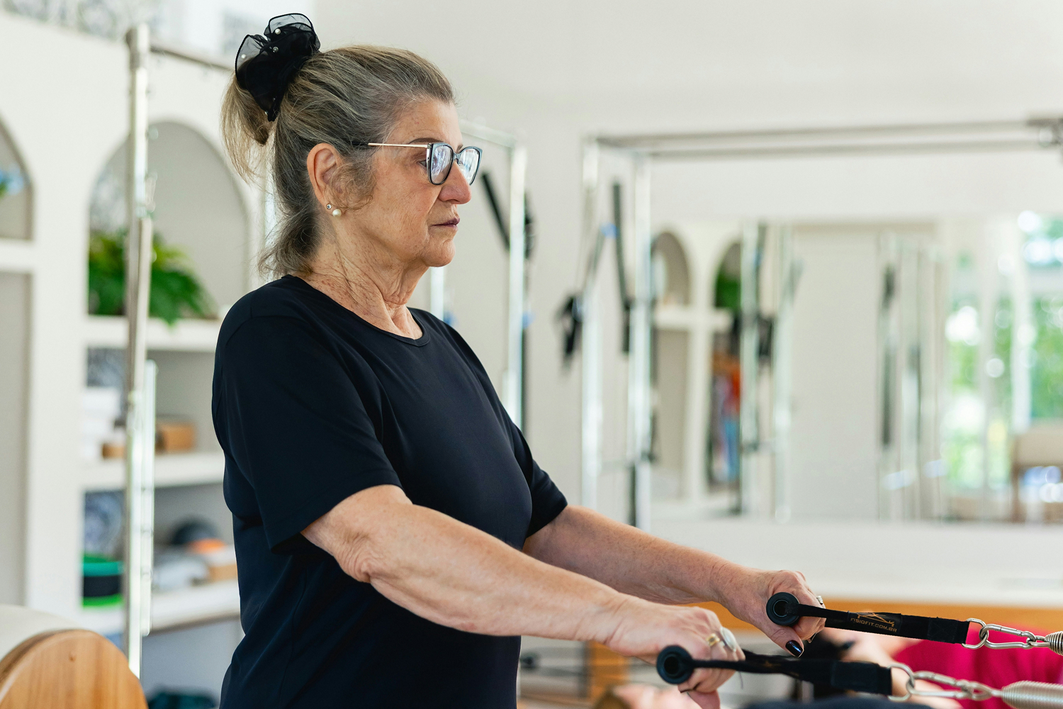 pilatesIndivisual Woman doing pilates for arms